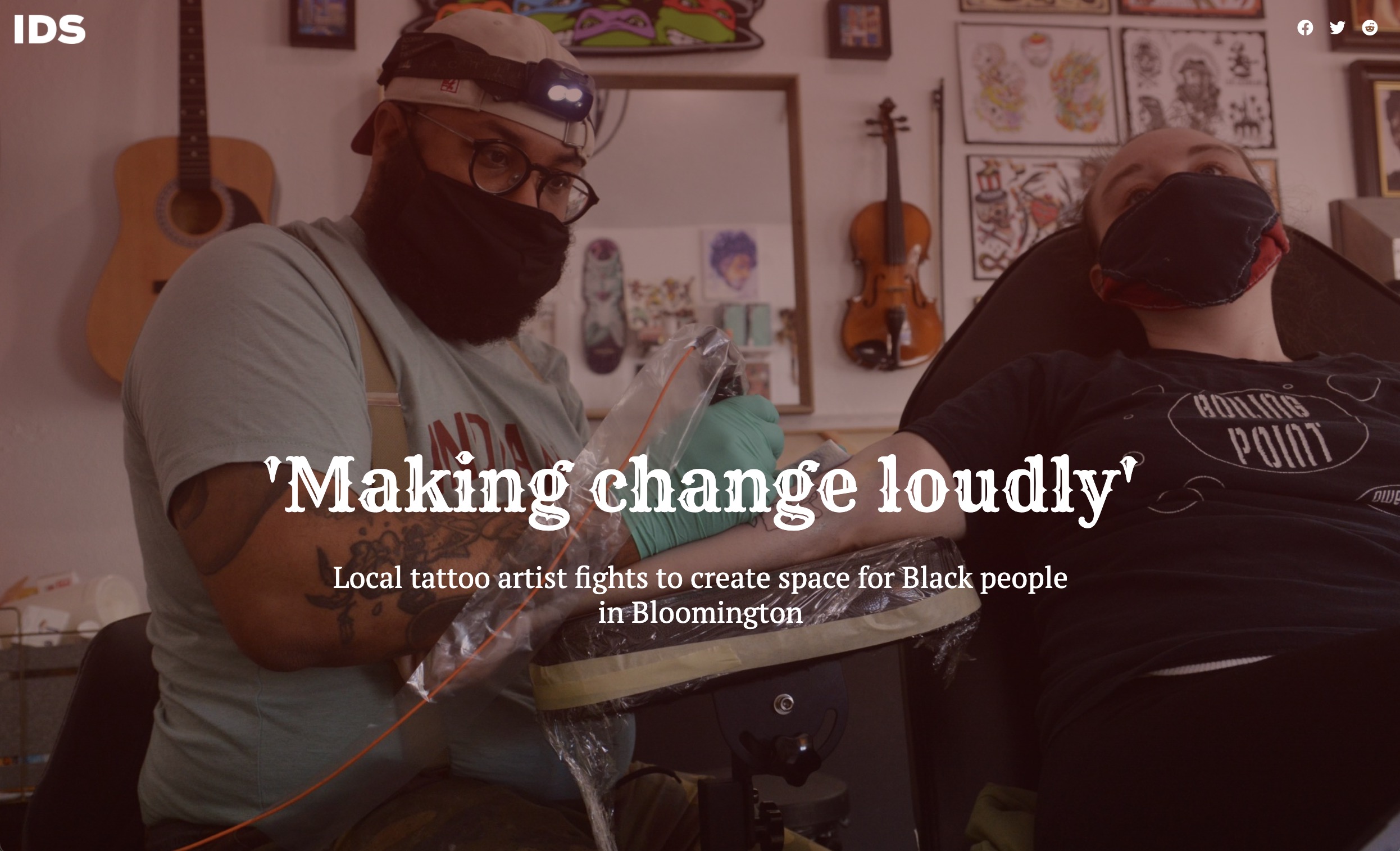 A photo of a man tattooing someone with the words 'Making change loudly: Local tattoo artist fights to create space for Black people in Bloomington'